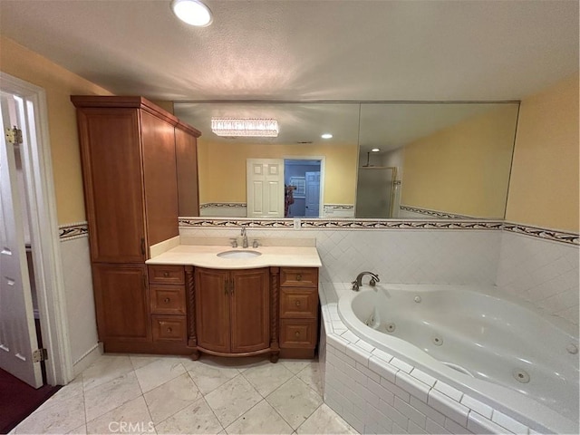 bathroom featuring tile patterned flooring, vanity, and separate shower and tub