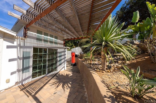 view of patio featuring a pergola