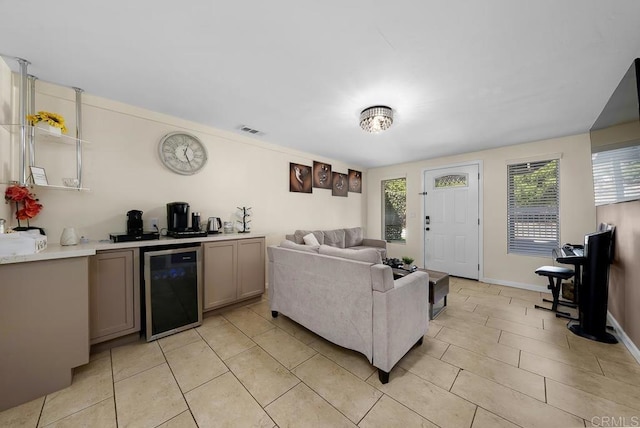 living room featuring bar area and beverage cooler