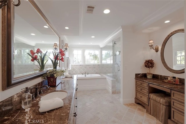 bathroom with vanity, ornamental molding, and separate shower and tub