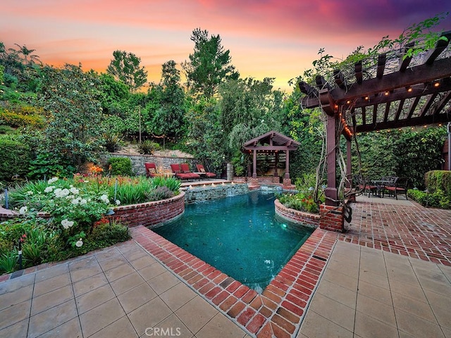 pool at dusk with a pergola, a gazebo, and a patio area