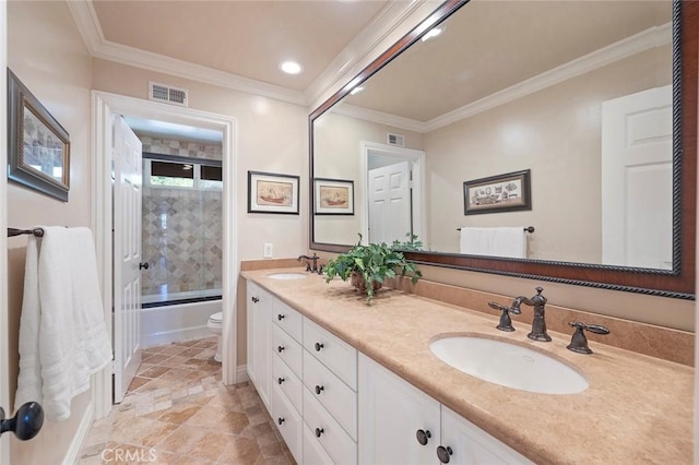 full bathroom with vanity, crown molding, toilet, and combined bath / shower with glass door