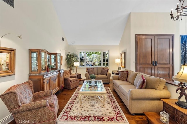 living room featuring a baseboard radiator, high vaulted ceiling, a notable chandelier, and dark hardwood / wood-style flooring