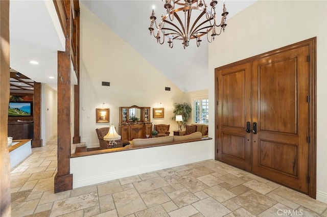 entrance foyer with high vaulted ceiling