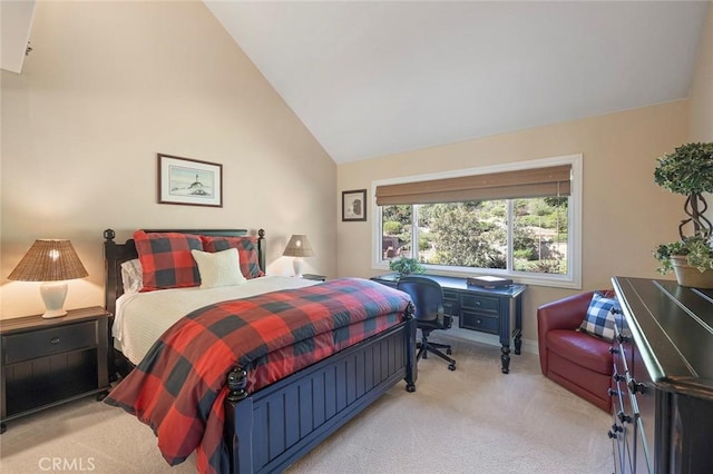 carpeted bedroom with lofted ceiling