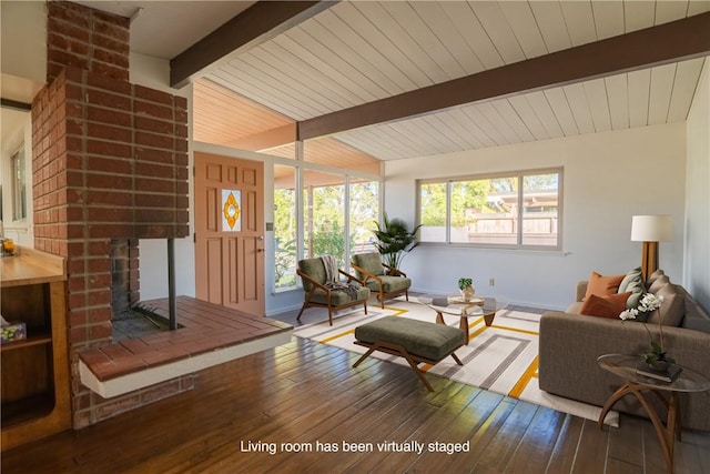 living room featuring wood ceiling, vaulted ceiling with beams, a fireplace, and wood-type flooring