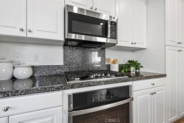 kitchen featuring tasteful backsplash, white cabinetry, and stainless steel appliances