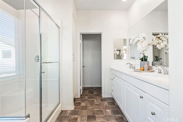 bathroom featuring vanity and an enclosed shower