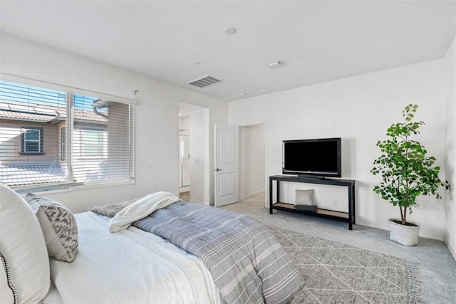 bedroom featuring light colored carpet