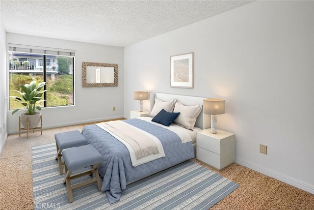 bedroom with light carpet and a textured ceiling