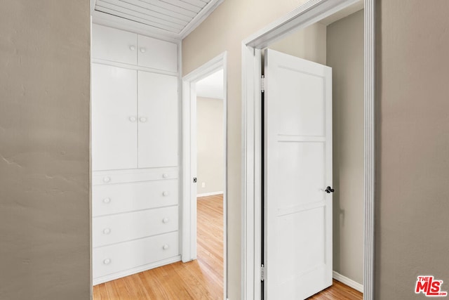 corridor with light hardwood / wood-style floors