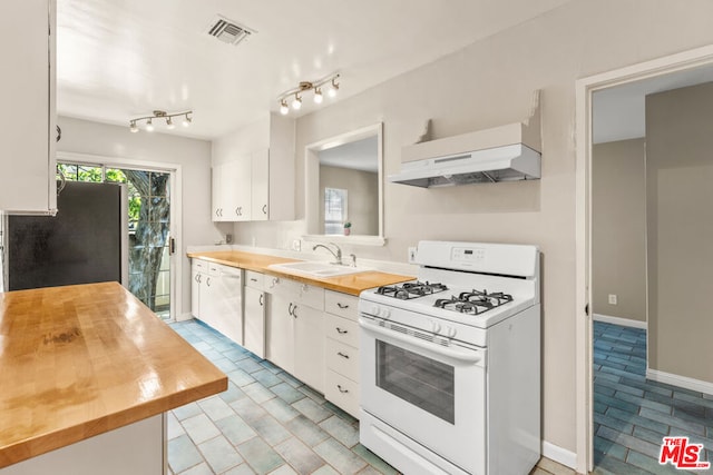 kitchen featuring wood counters, white appliances, exhaust hood, white cabinets, and sink