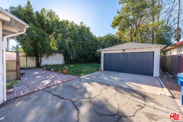 garage featuring a yard