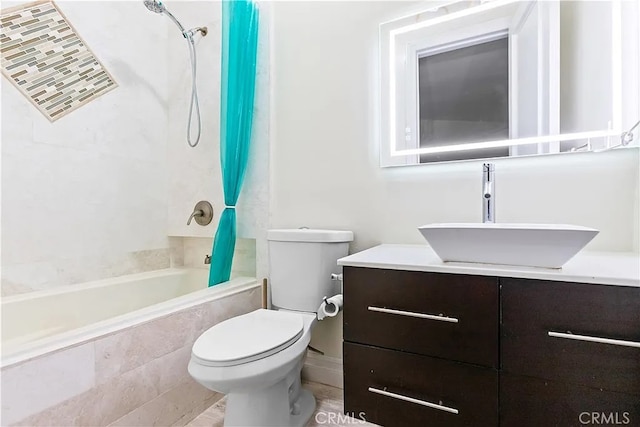 full bathroom with vanity, shower / bath combination with curtain, and toilet