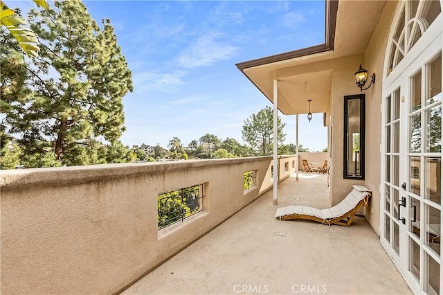 balcony featuring french doors