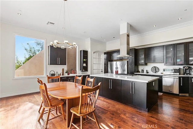 interior space with a chandelier, dark hardwood / wood-style floors, and ornamental molding