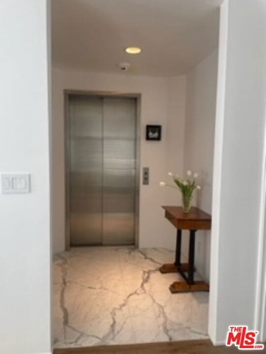 hallway featuring elevator