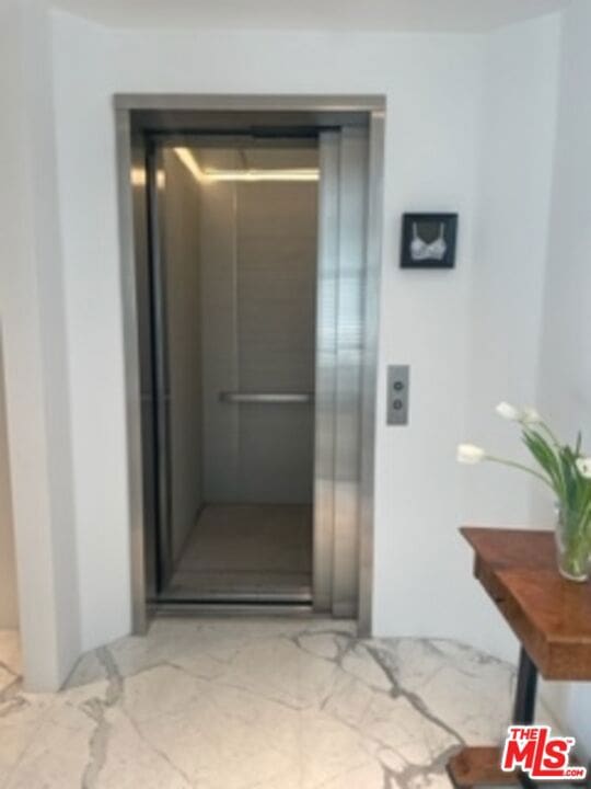 entrance to property featuring elevator