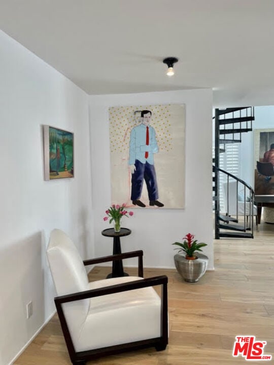 living area with hardwood / wood-style floors