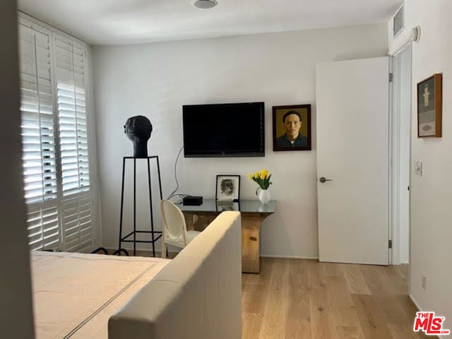 bedroom featuring light wood-type flooring