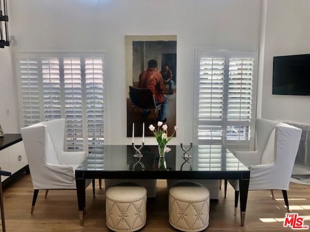 dining area with hardwood / wood-style floors