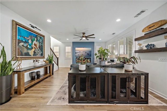 interior space with light hardwood / wood-style flooring and ceiling fan