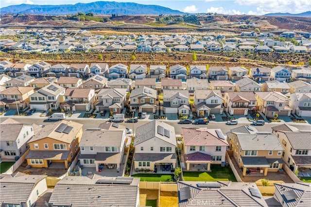 birds eye view of property with a mountain view