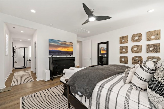 bedroom featuring hardwood / wood-style floors and ceiling fan