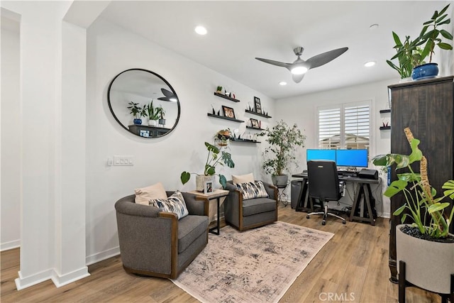 office space featuring light hardwood / wood-style floors and ceiling fan