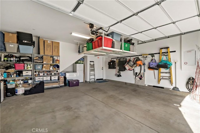 garage featuring white fridge