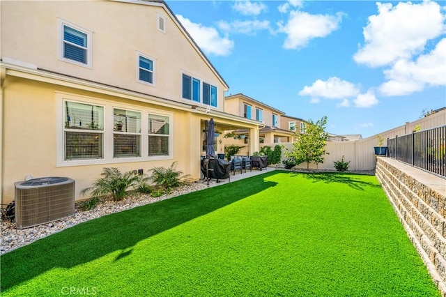 view of yard with a patio and central AC unit