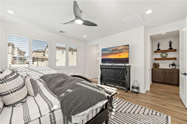 bedroom featuring light wood-type flooring and ceiling fan