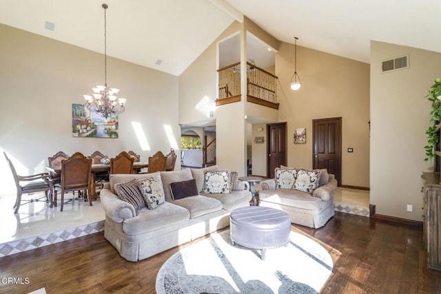 living room featuring an inviting chandelier, dark hardwood / wood-style floors, and high vaulted ceiling