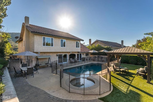 view of swimming pool featuring a yard, a gazebo, and a patio area