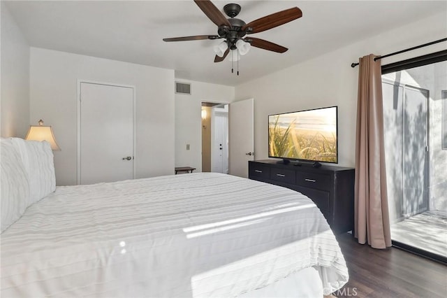 bedroom featuring ceiling fan and dark hardwood / wood-style floors