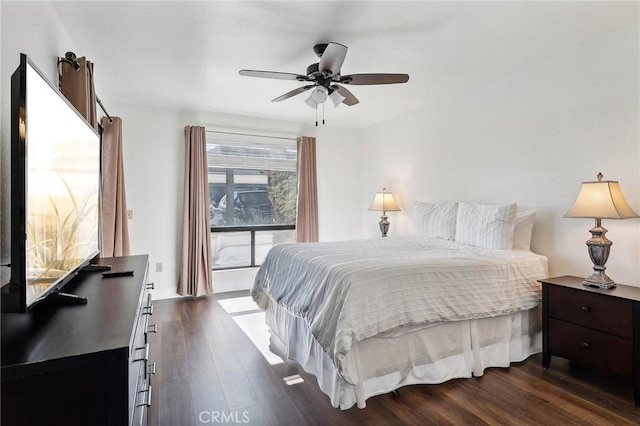 bedroom featuring ceiling fan and dark wood-type flooring