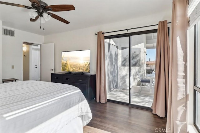 bedroom featuring dark wood-type flooring, ceiling fan, access to outside, and multiple windows