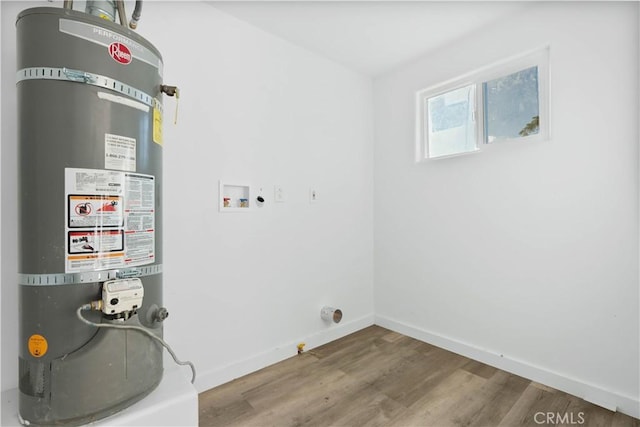 utility room featuring water heater