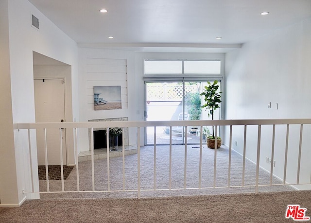 hallway with carpet