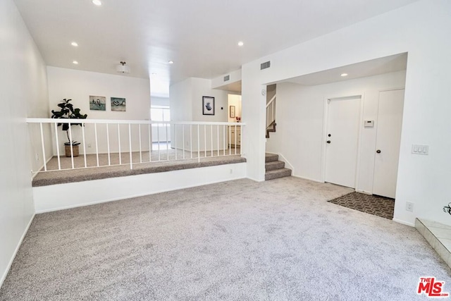 unfurnished room with carpet floors