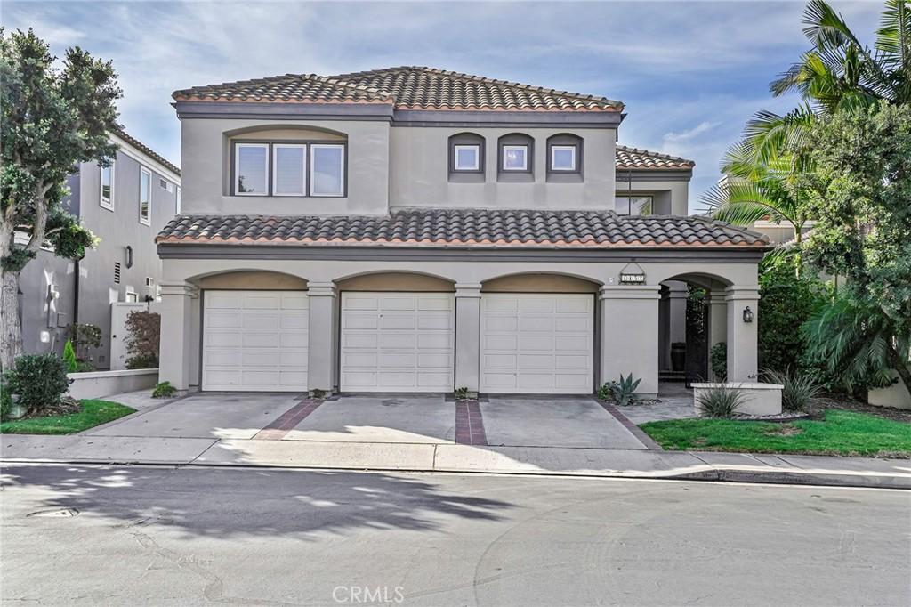 mediterranean / spanish-style home with a garage