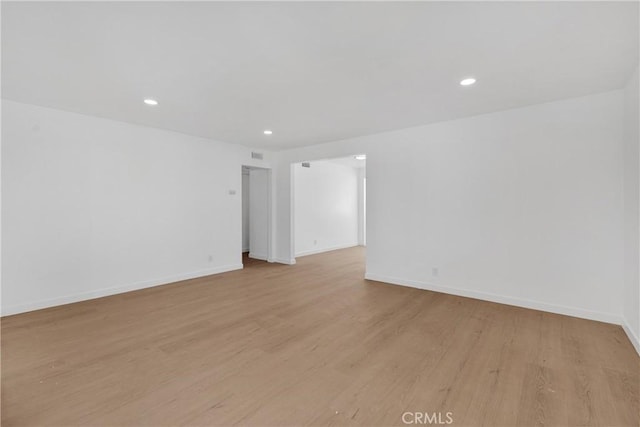 unfurnished room featuring light hardwood / wood-style flooring