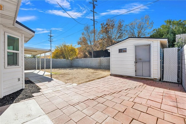 view of patio / terrace featuring a shed