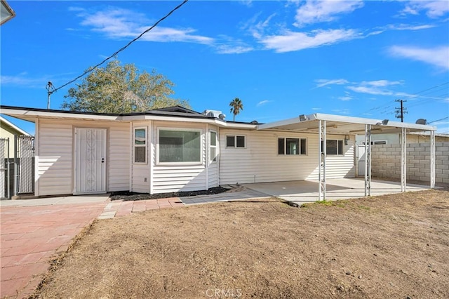 rear view of house featuring a patio