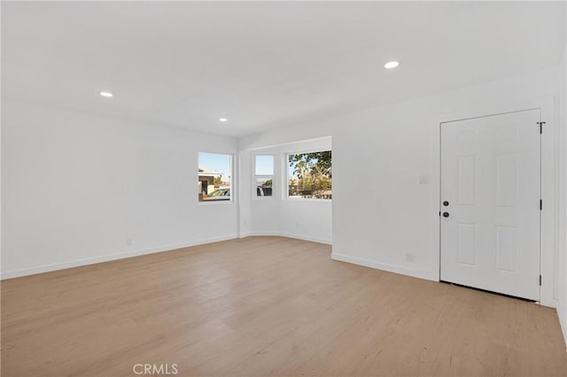 unfurnished room featuring light hardwood / wood-style flooring