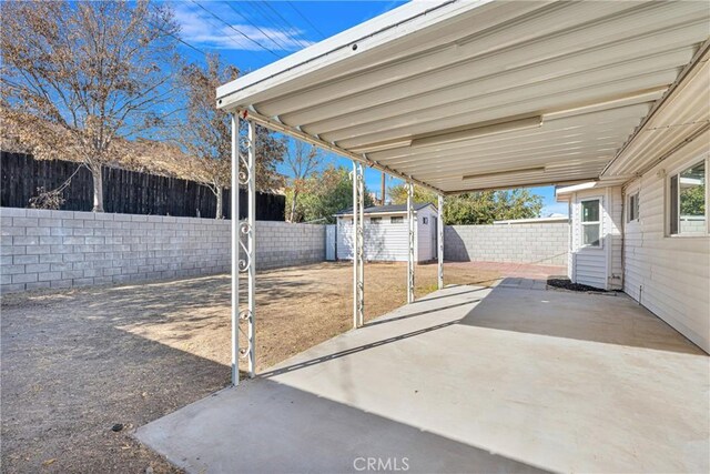 view of patio with a shed