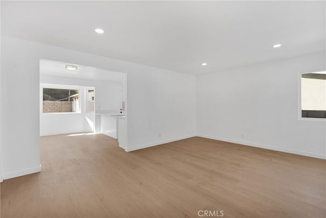 spare room with light hardwood / wood-style floors