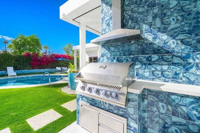 view of patio / terrace featuring area for grilling and exterior kitchen