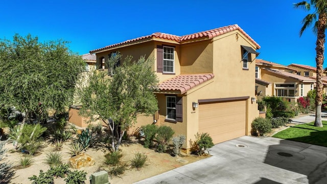 mediterranean / spanish-style home featuring a garage