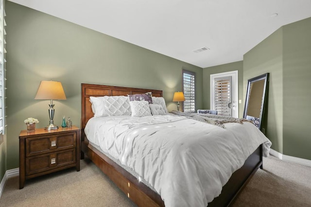 bedroom featuring light carpet